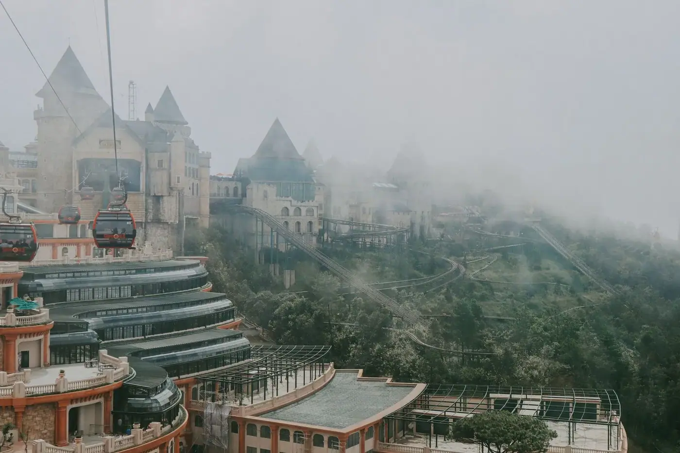 Aerial view over Ba Na Hills resort buildings in the clouds