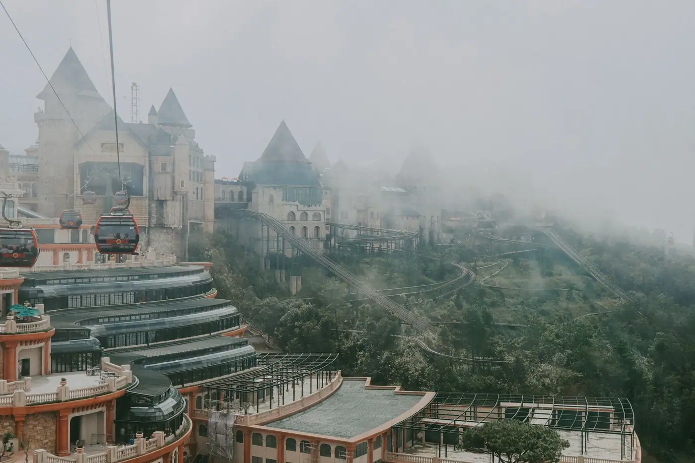 Aerial view of the French Village at Ba Na Hills wrapped in mist