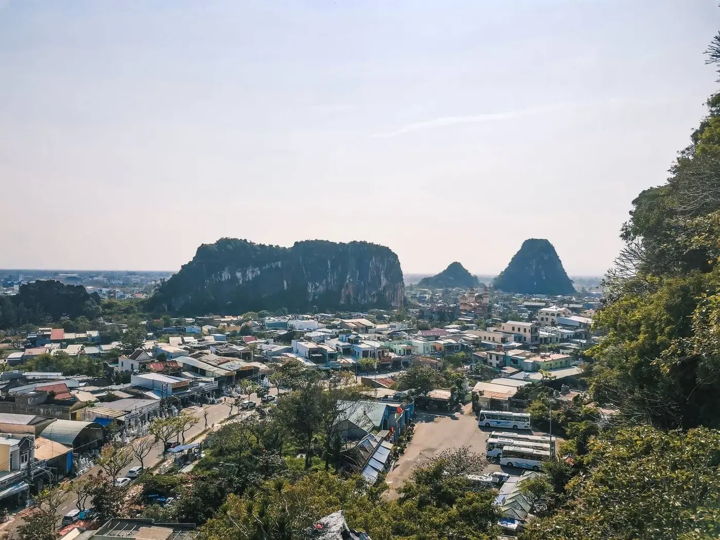 Limestone Marble Mountains peaks rising above Da Nang rooftops