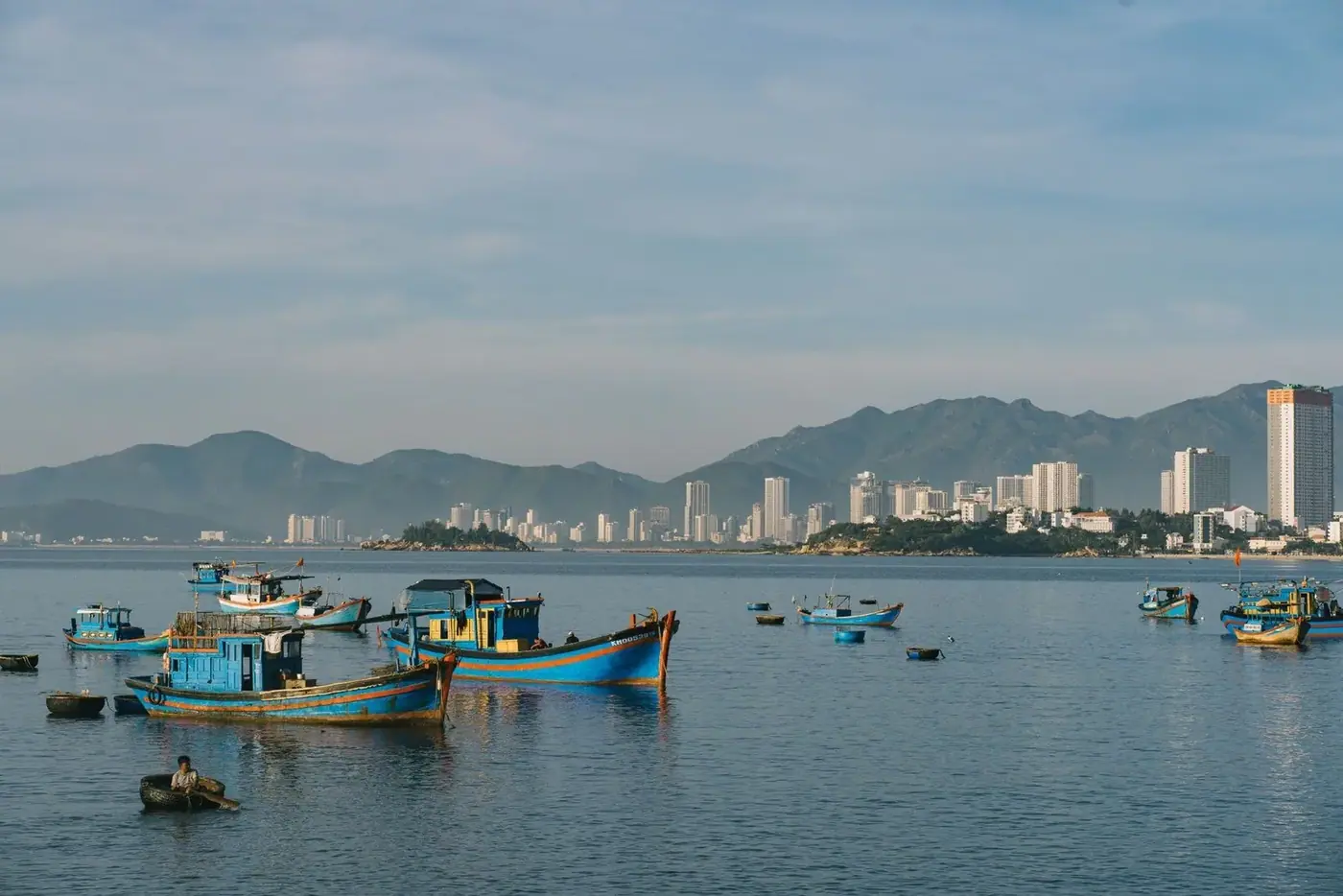 Fishing boats anchored off the Nha Trang city skyline