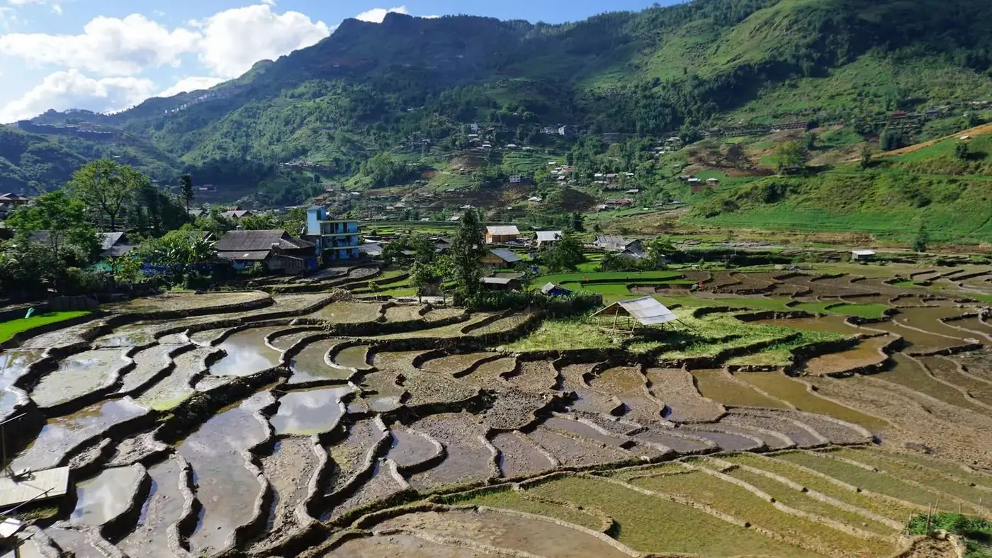 Green rice terraces and a village in the Muong Hoa valley near Sapa