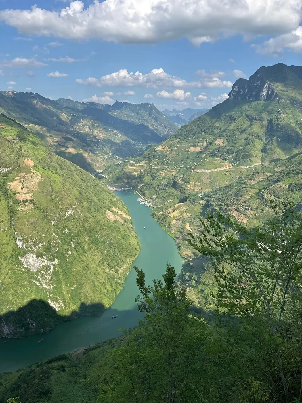 River canyon with green mountain slopes seen from the Ma Pi Leng road in northern Vietnam