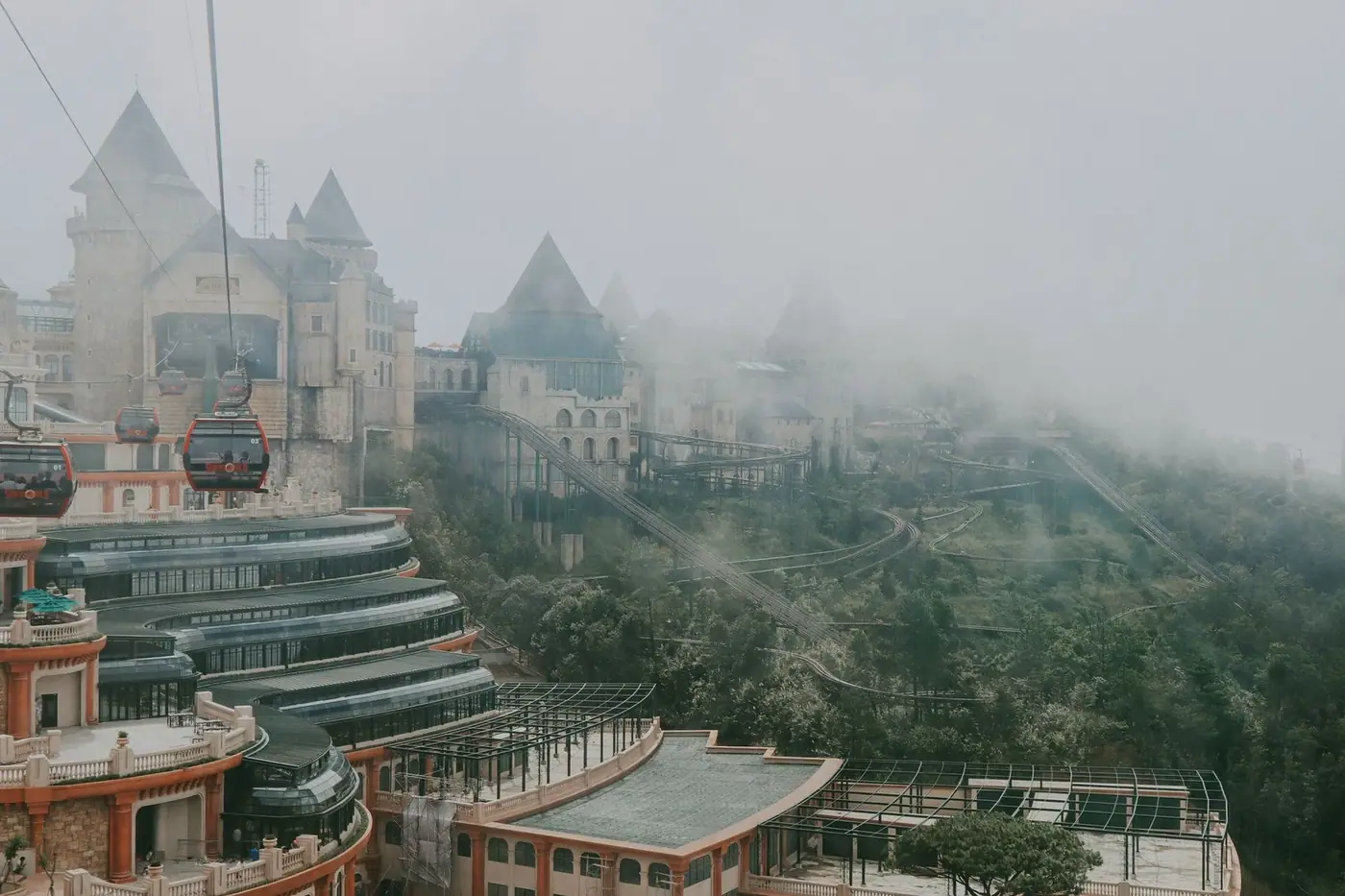 Ba Na Hills’ French Village viewpoint wrapped in mountain mist, seen from above