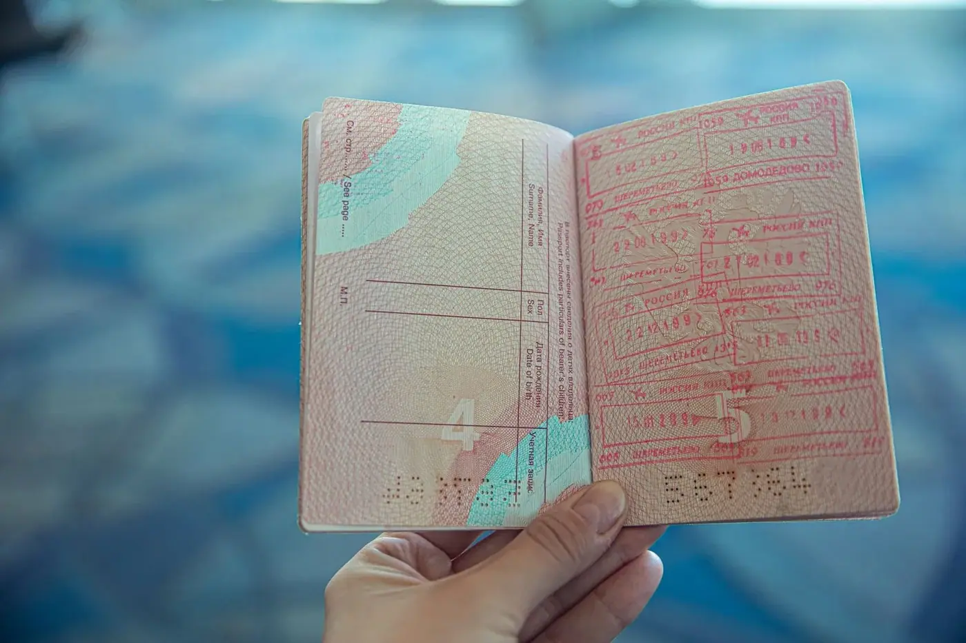 Passport with visa stamps and travel documents