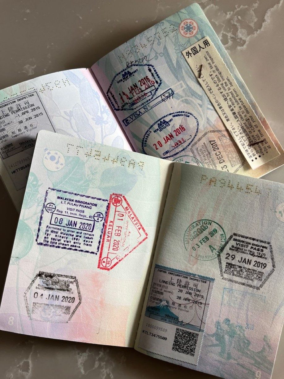Open passport with stamps from multiple countries