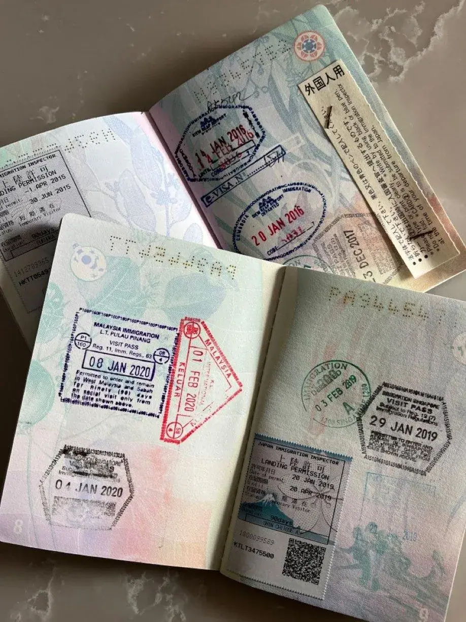 Open passport with stamps from multiple countries