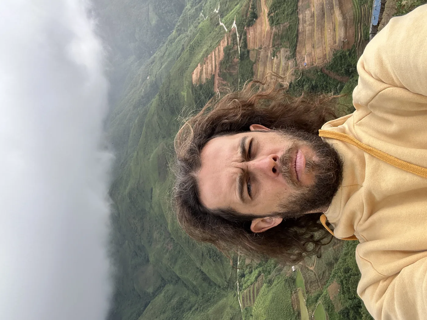 Traveler taking a selfie on rice terraces near Sapa