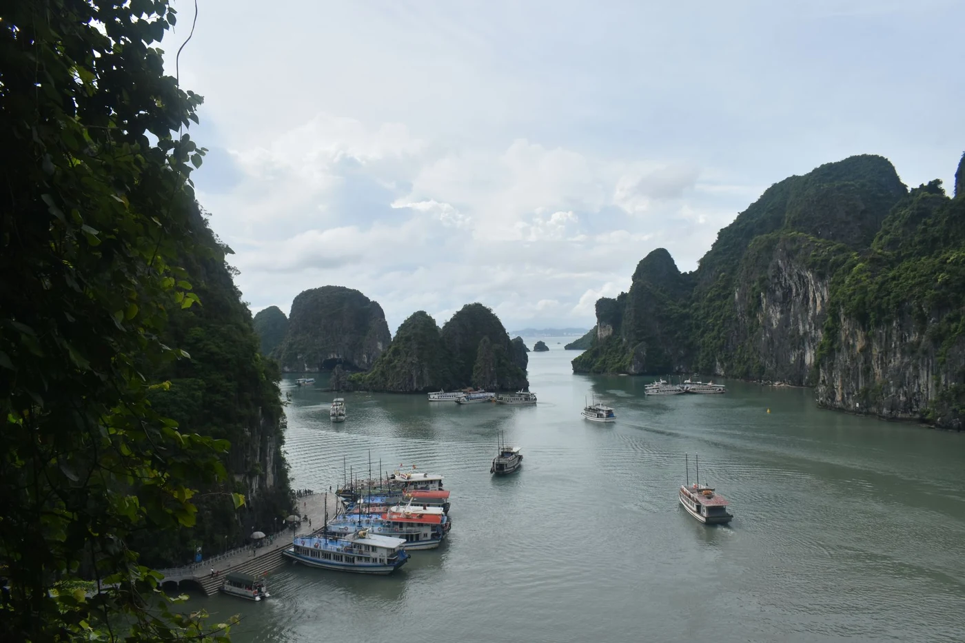 Boats moored among limestone islands in Ha Long Bay