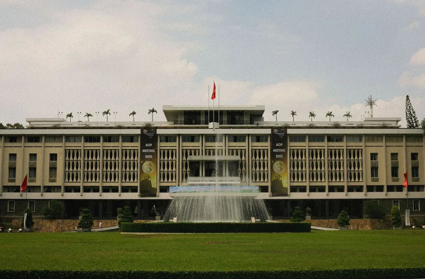 Front of Independence Palace with a fountain and lawn in Ho Chi Minh City