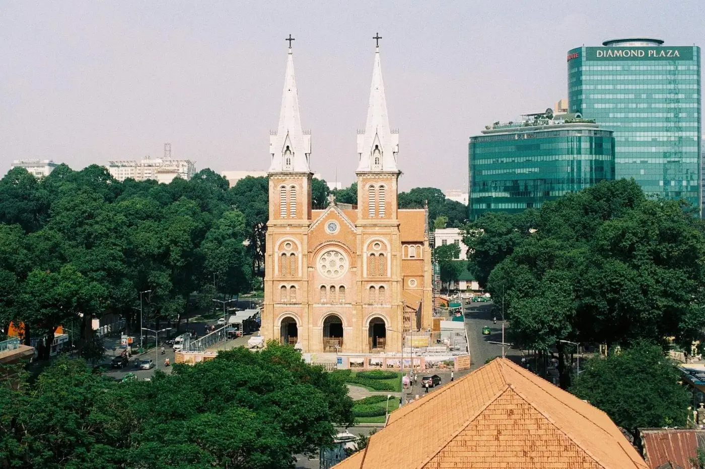 Notre-Dame Cathedral Basilica of Saigon with restoration fencing around its base
