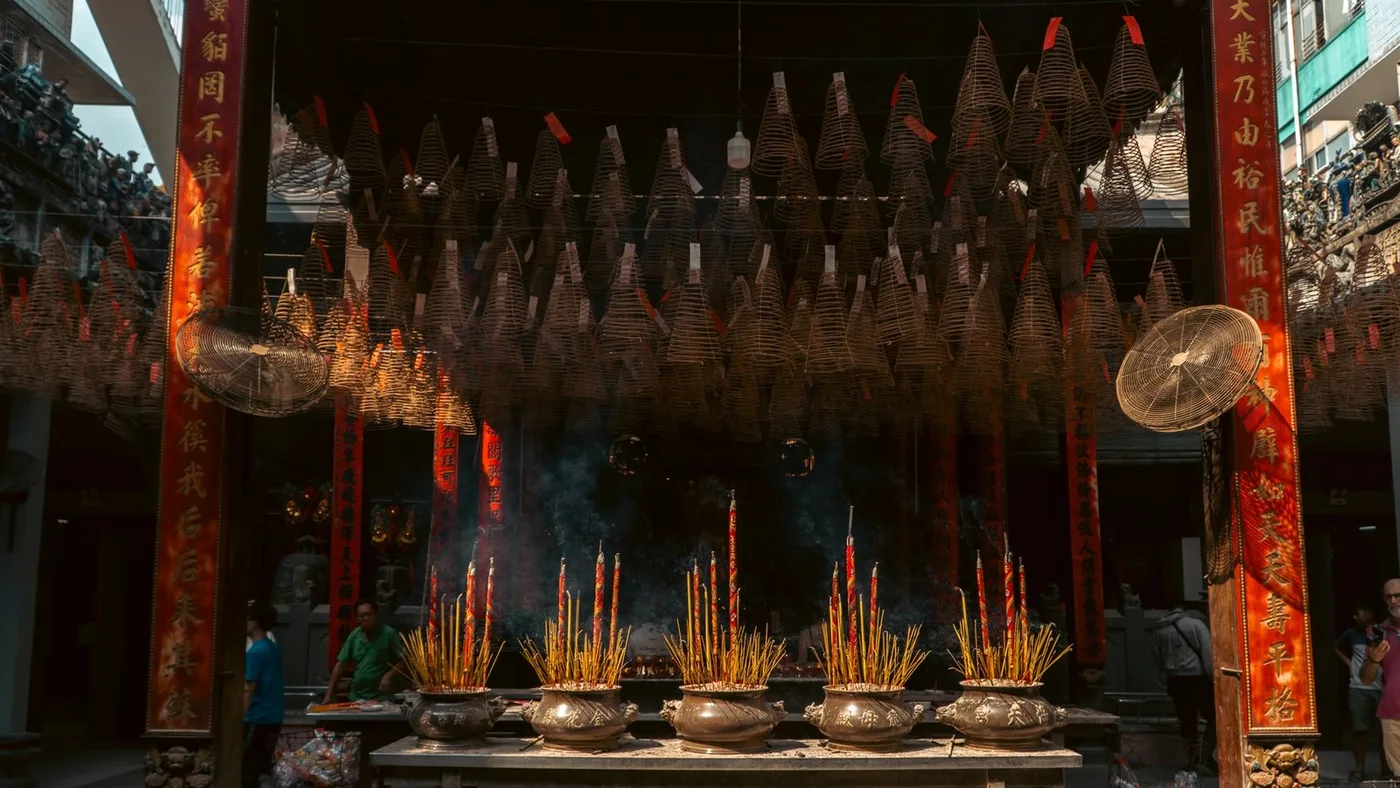 Hanging incense coils and burning joss sticks inside Thien Hau Temple in Cholon