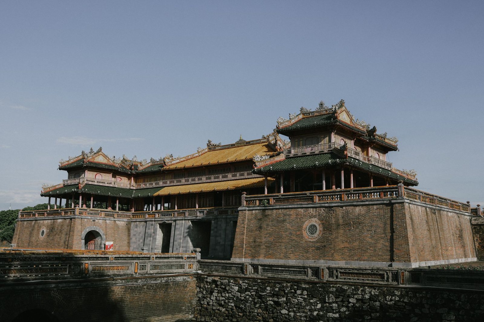 Low-angle view of the fortified gate and pavilion of Hue’s Imperial City Citadel