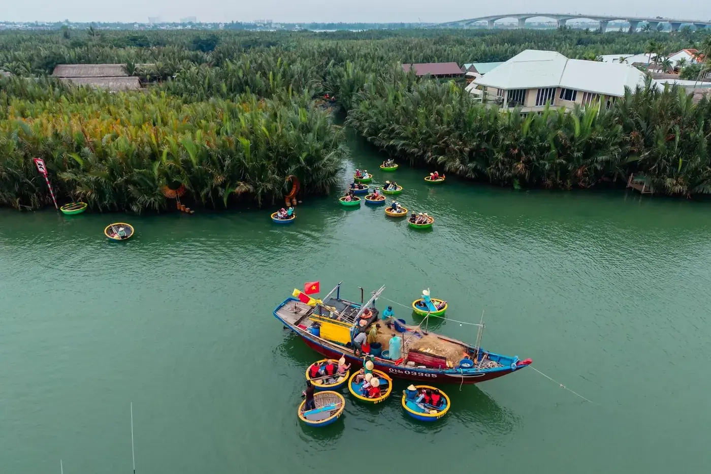 Aerial view of round coconut basket boats on a river near Hoi An