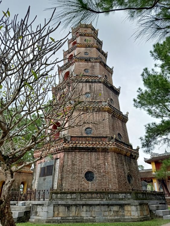 Thien Mu Pagoda surrounded by tropical greenery on the Perfume River bank