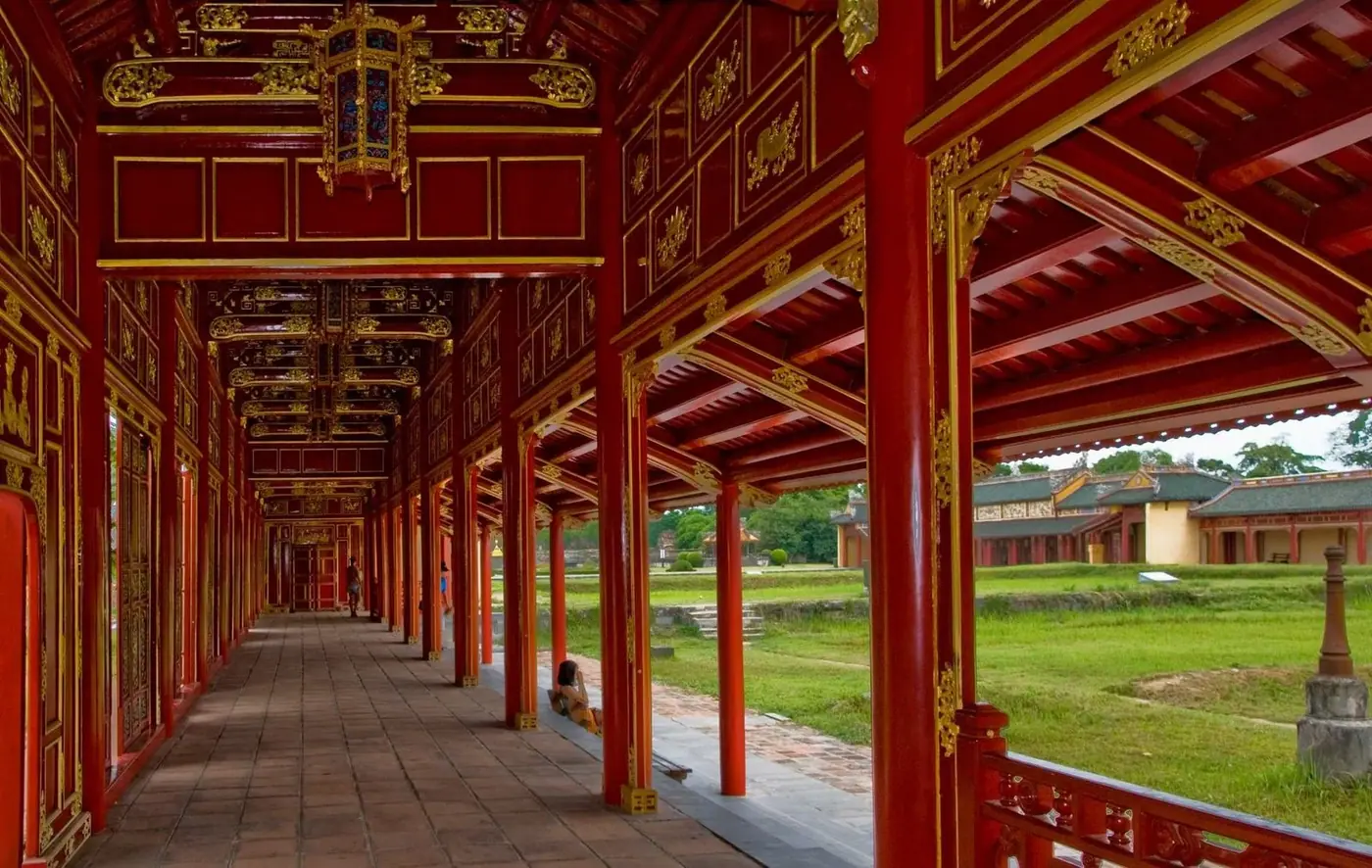 Red and gold lacquered corridor inside Hue Imperial City’s palace complex