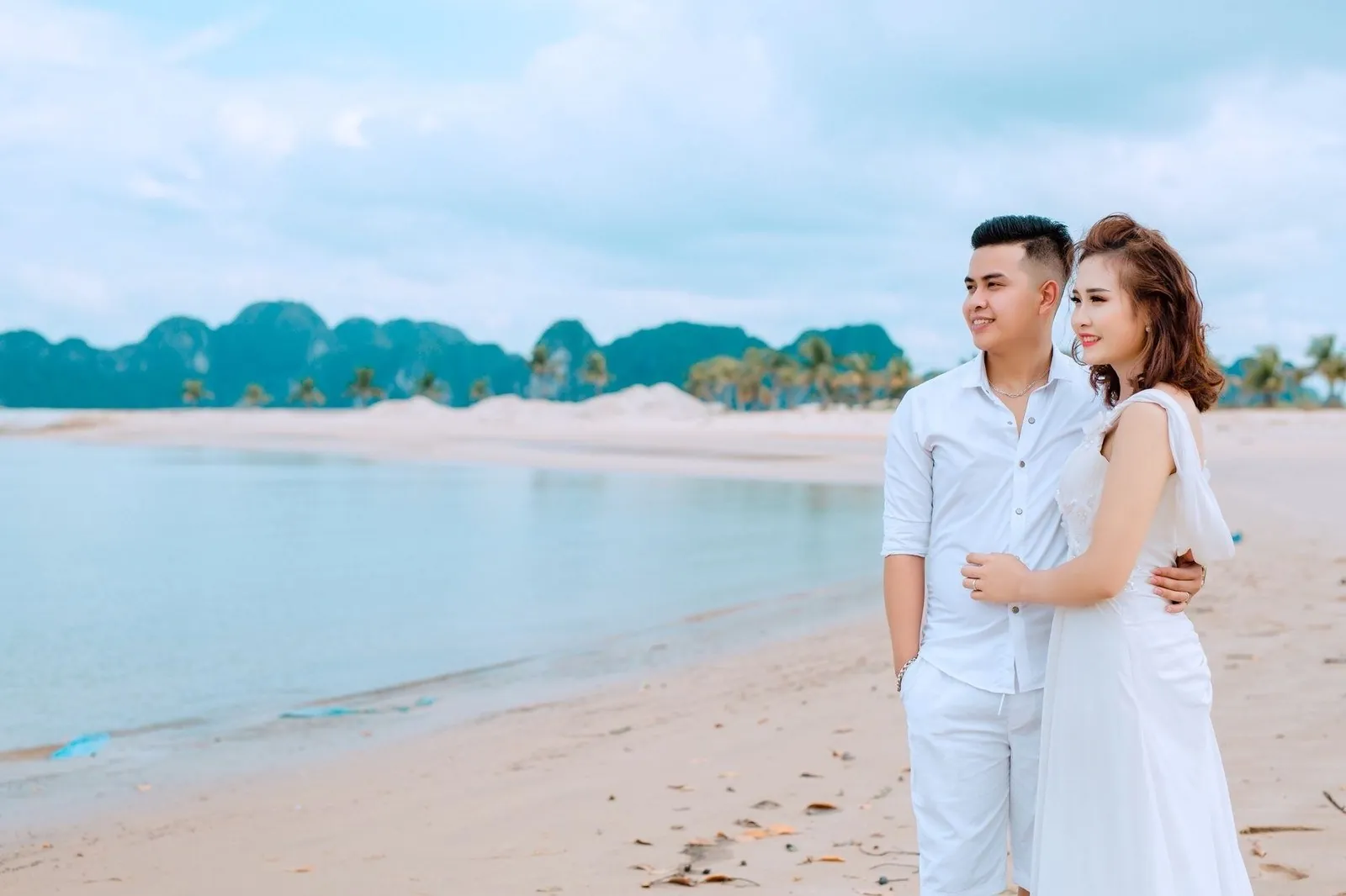 Couple embracing on a beach in Vietnam