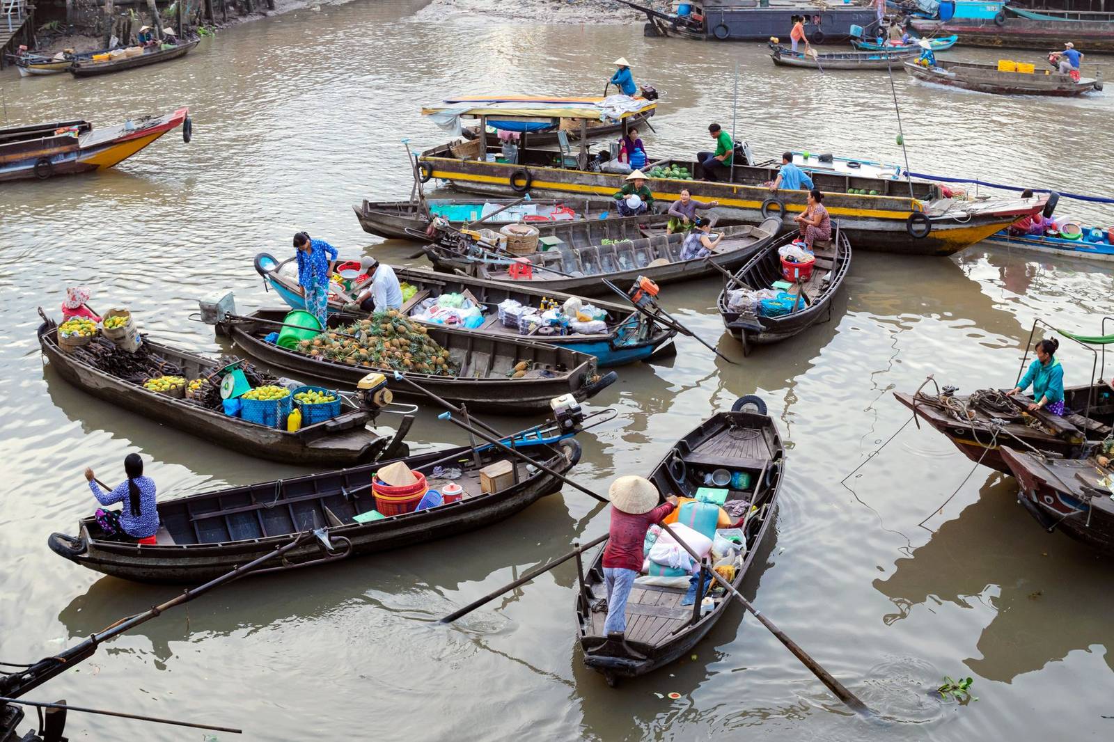 Vendors trading fruit and goods at a floating market near Can Tho