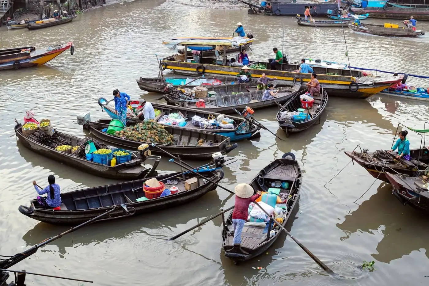 Vendors trading fruit and goods at a floating market near Can Tho