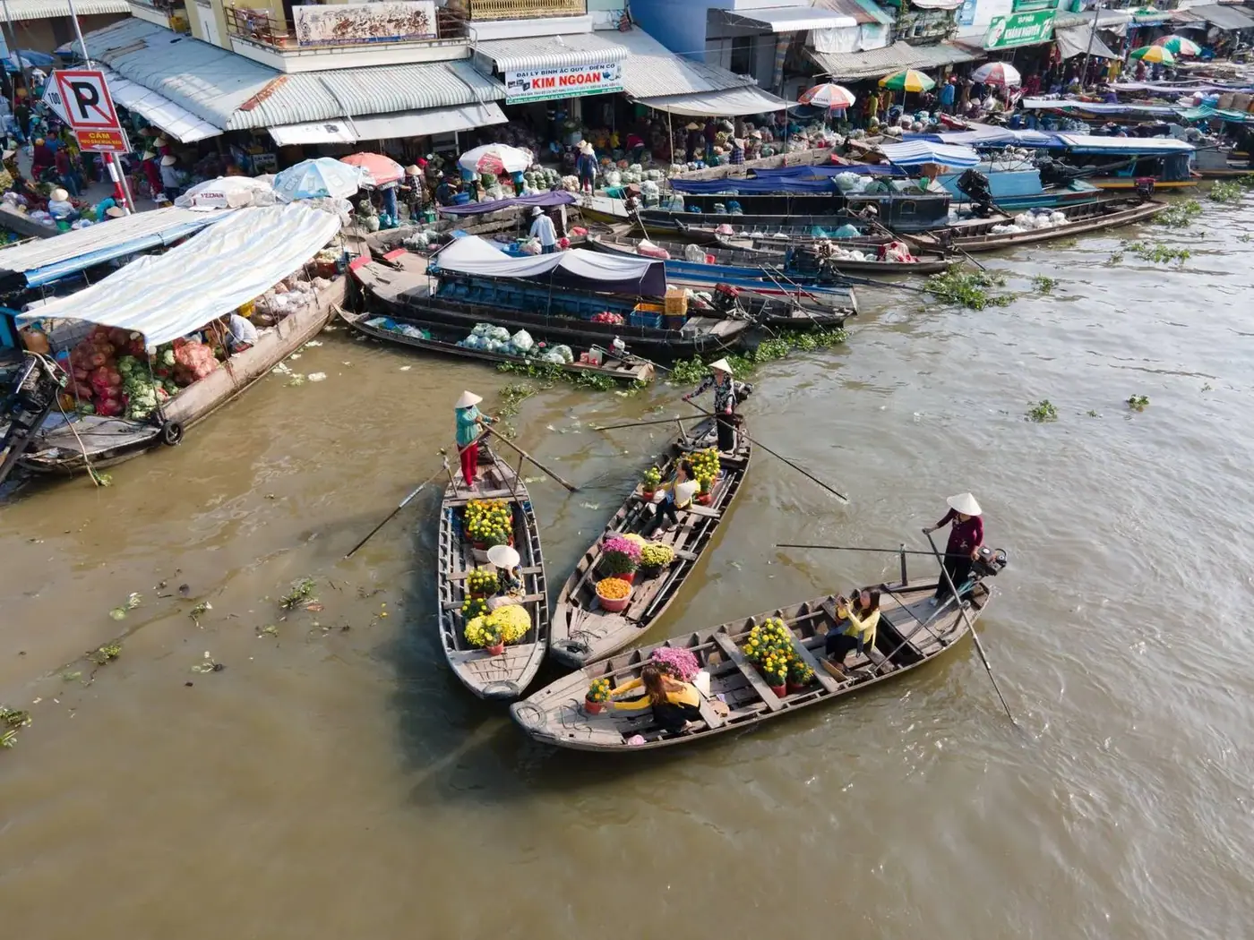 Traditional boats moored at a floating market on a river in Vietnam