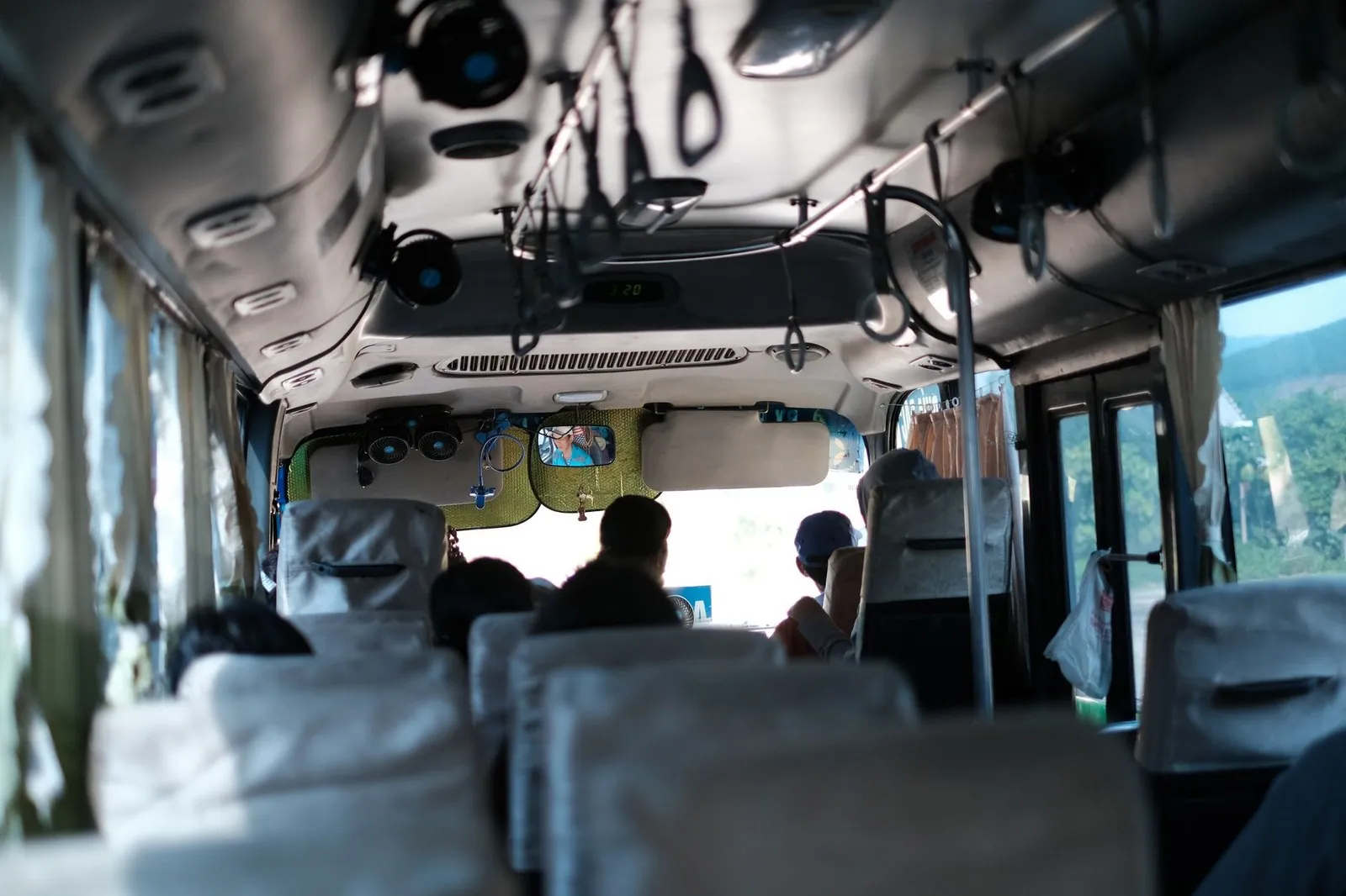 Interior view of a public bus traveling through the Vietnamese countryside