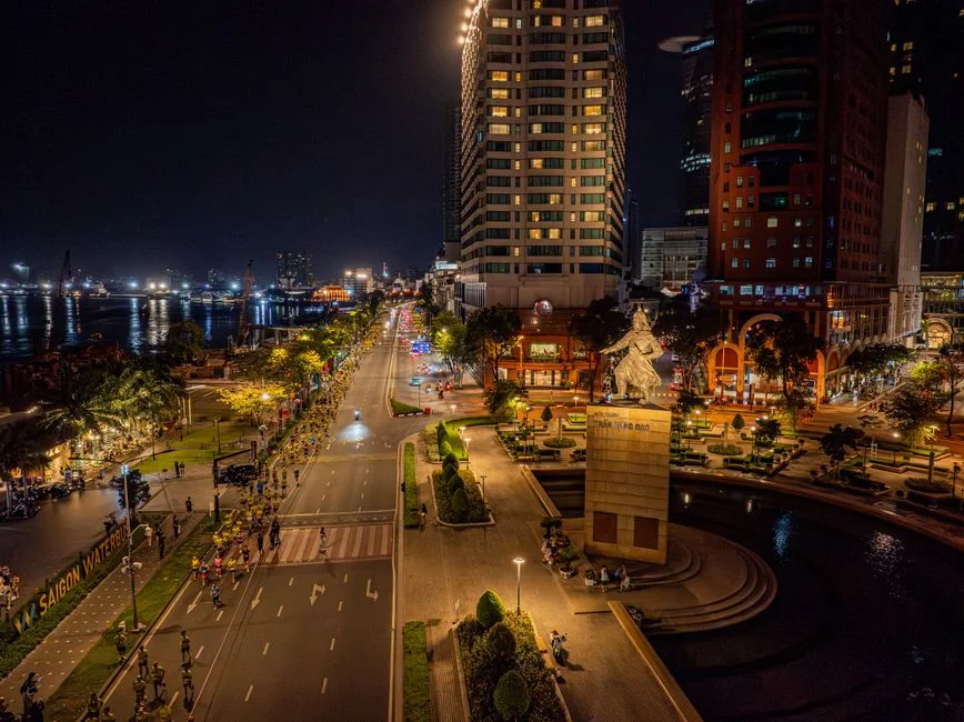 Ho Chi Minh City’s Nguyen Hue boulevard at night with vibrant lights and crowds