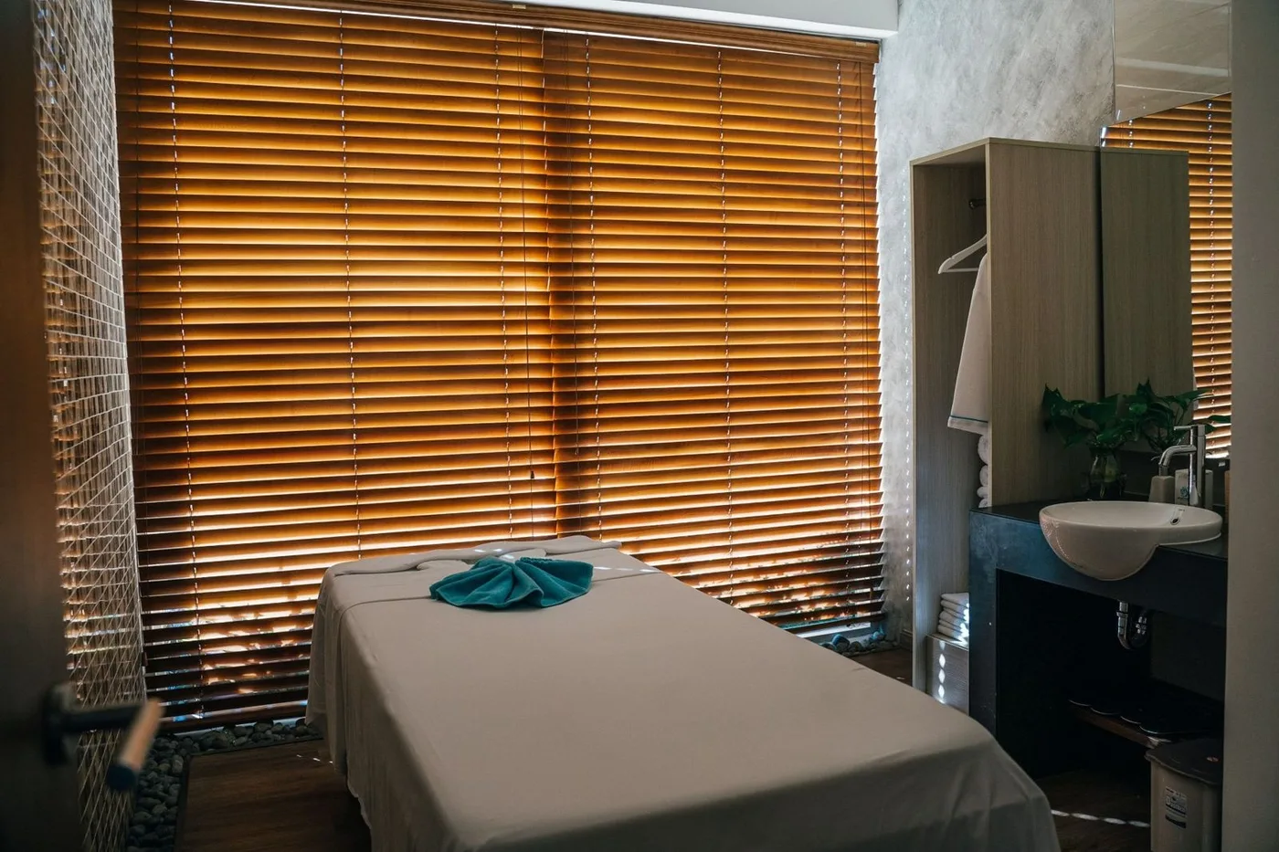 Therapist working on a client on a marble spa table