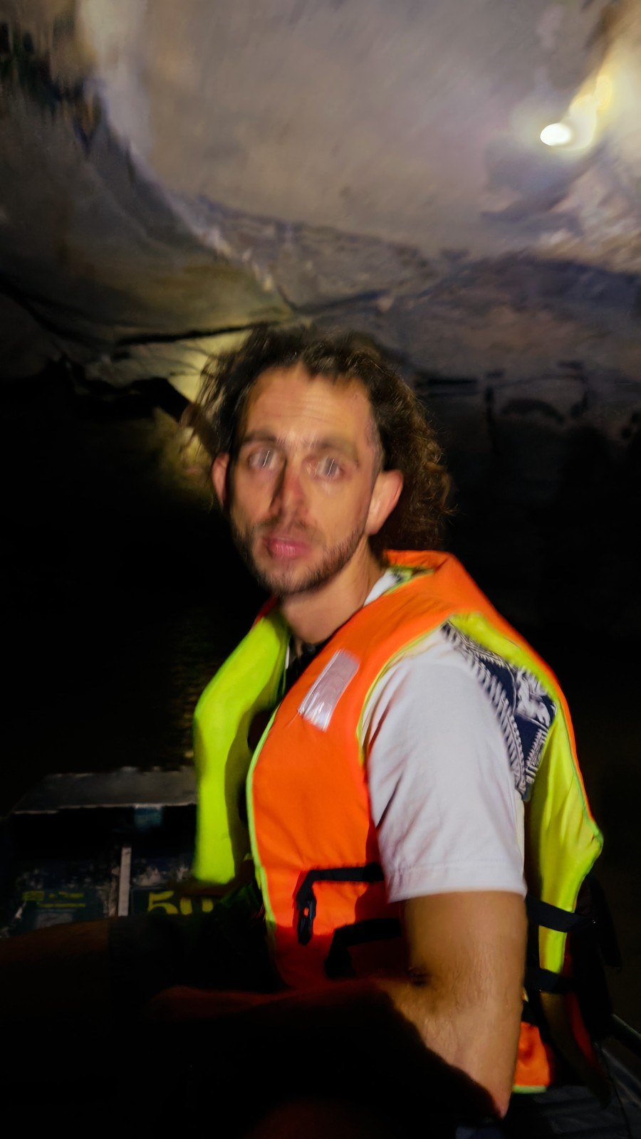 Close-up portrait wearing a life vest during a Ninh Binh boat tour