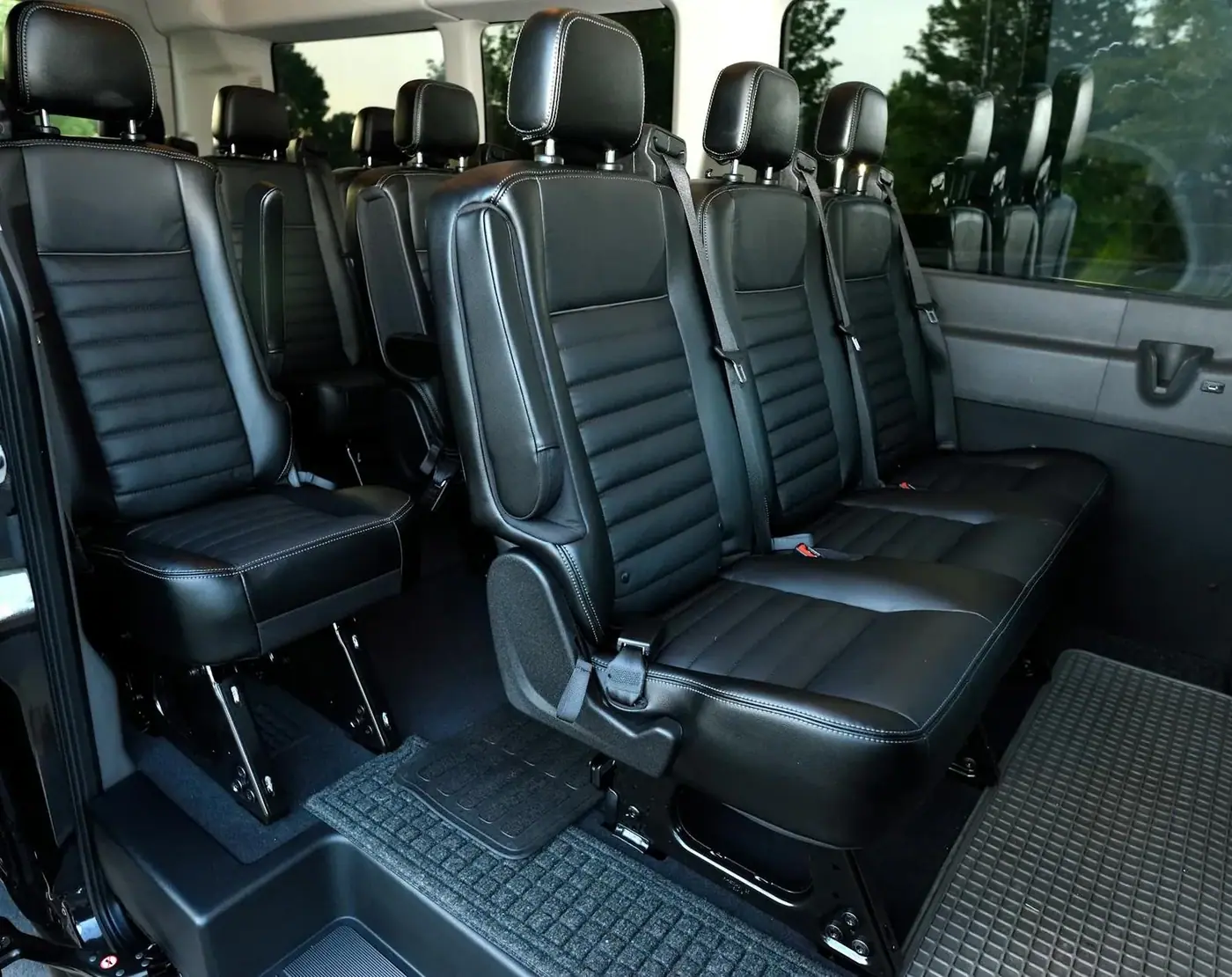 Kia Carnival leather interior — our transport for overstay cases out of Da Nang