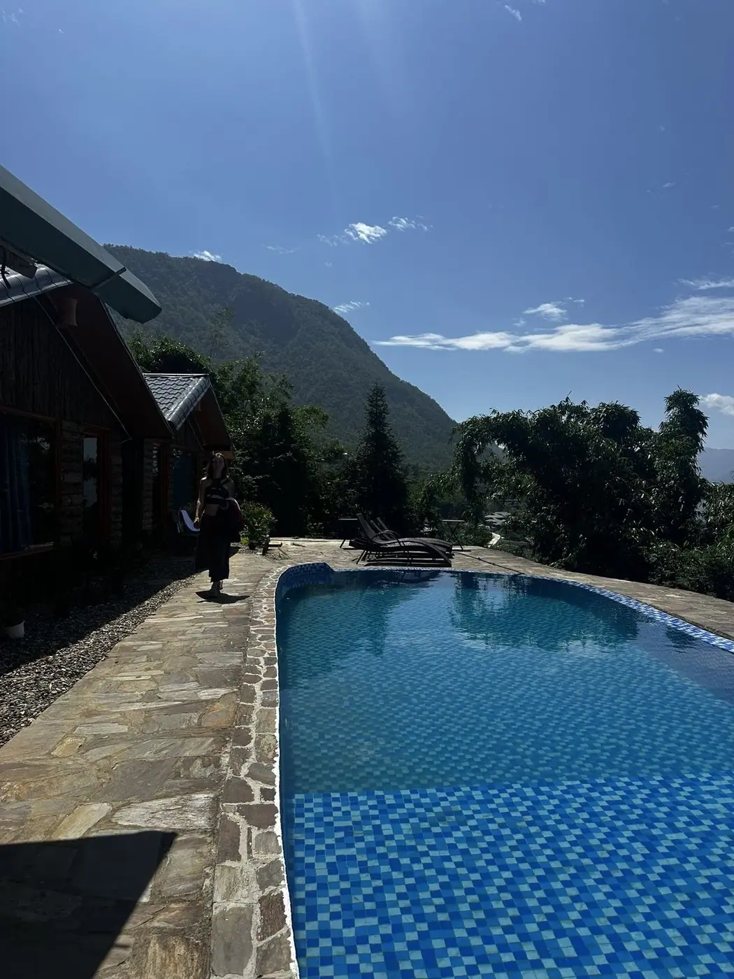 Hillside villa pool overlooking mountains in Vietnam