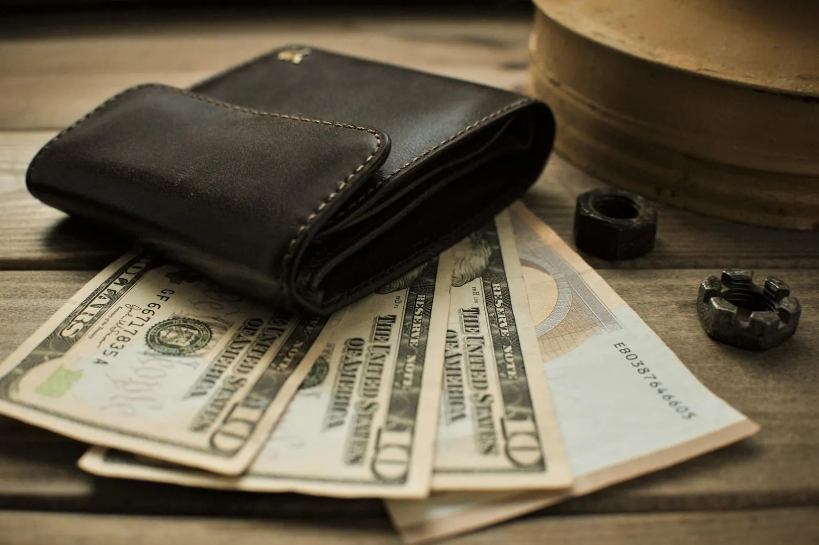 Leather wallet with US dollar bills — carrying cash across the Vietnam border