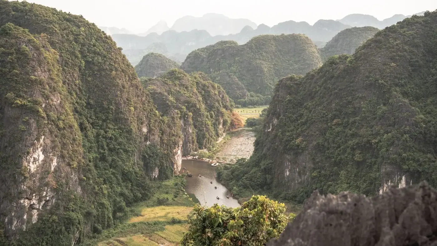 Aerial view of limestone karst mountains and a river valley in Vietnam