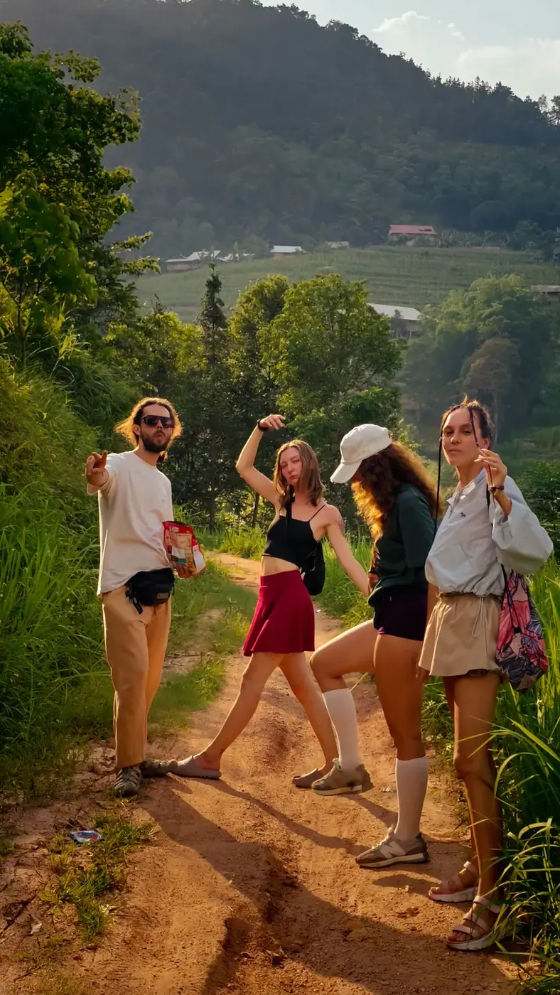 A guide-led group pausing on a rice terrace trail