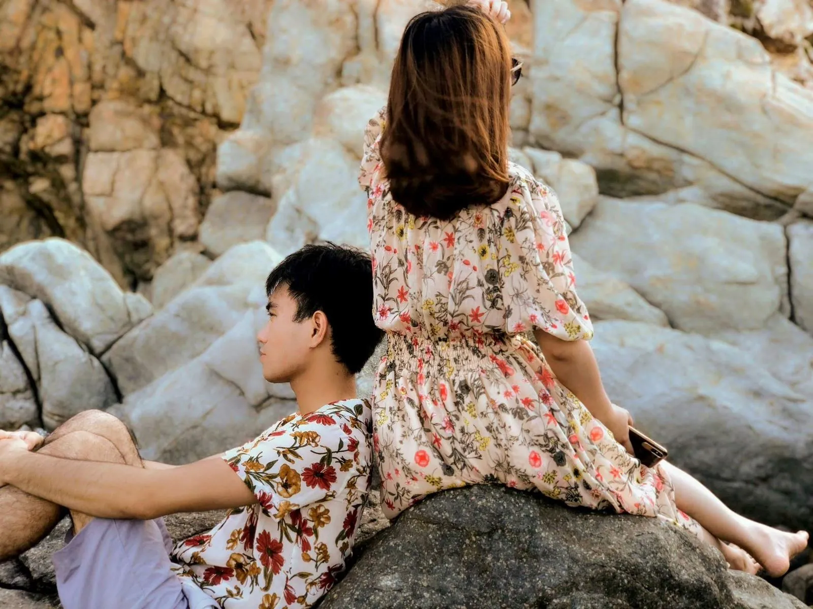 Travelers on the rocky coastline near Quy Nhon, Vietnam