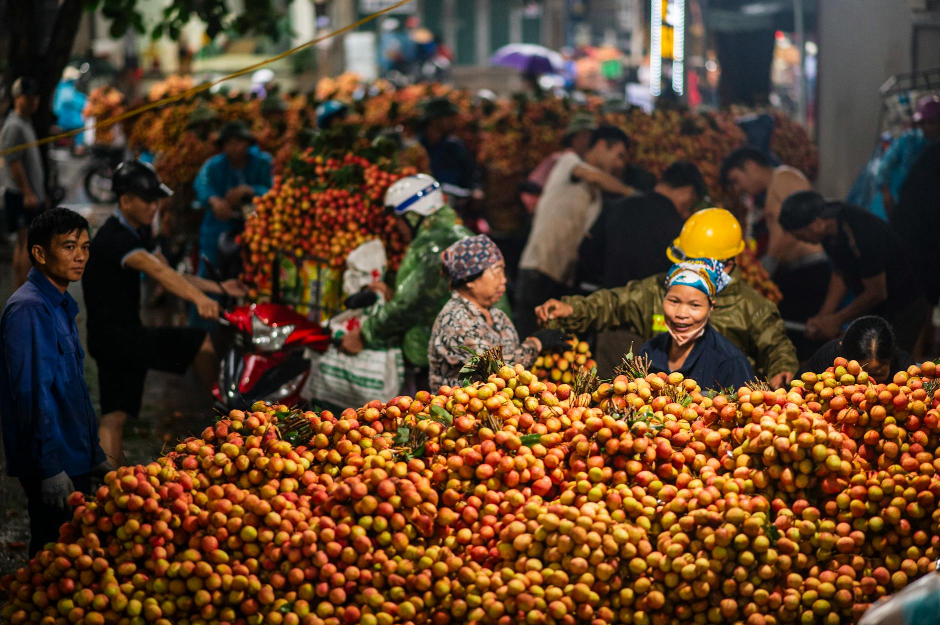 Vibrant Vietnamese fruit market with lychees