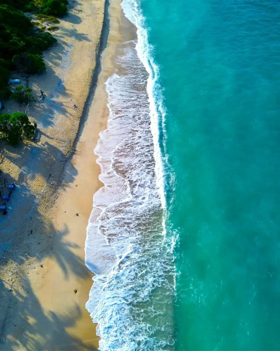 Close-up of ocean waves rolling onto a sandy beach in central Vietnam