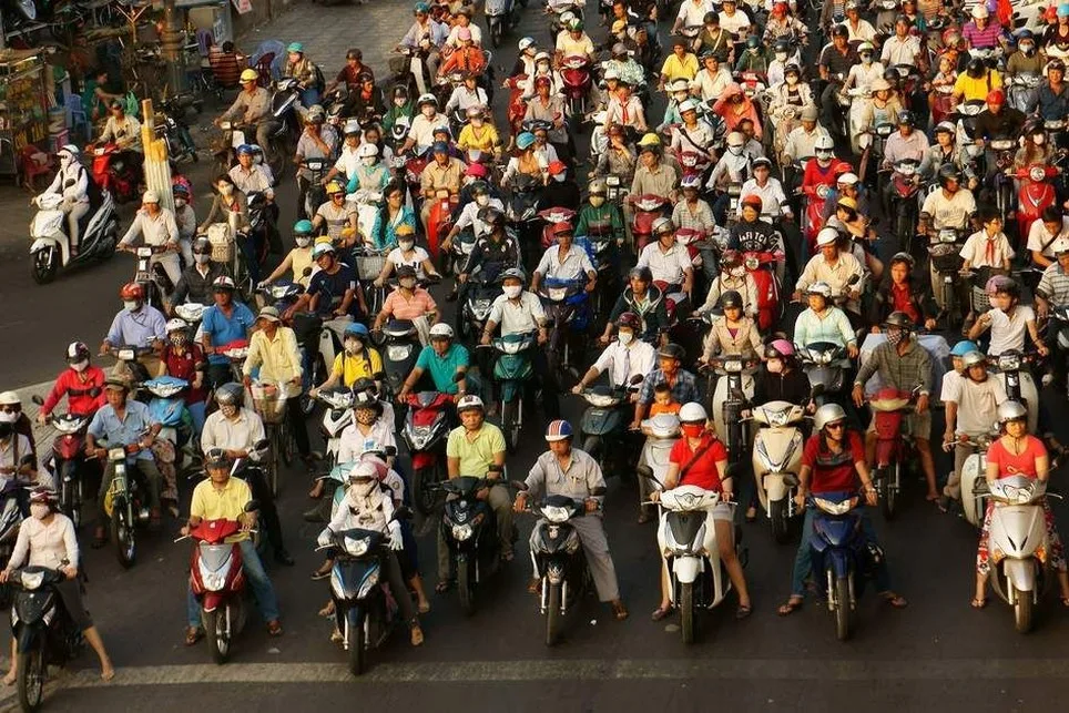 Motorbikes lined up at an intersection in Ho Chi Minh City