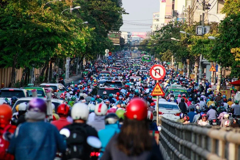 Dense motorbike traffic on a street in Ho Chi Minh City