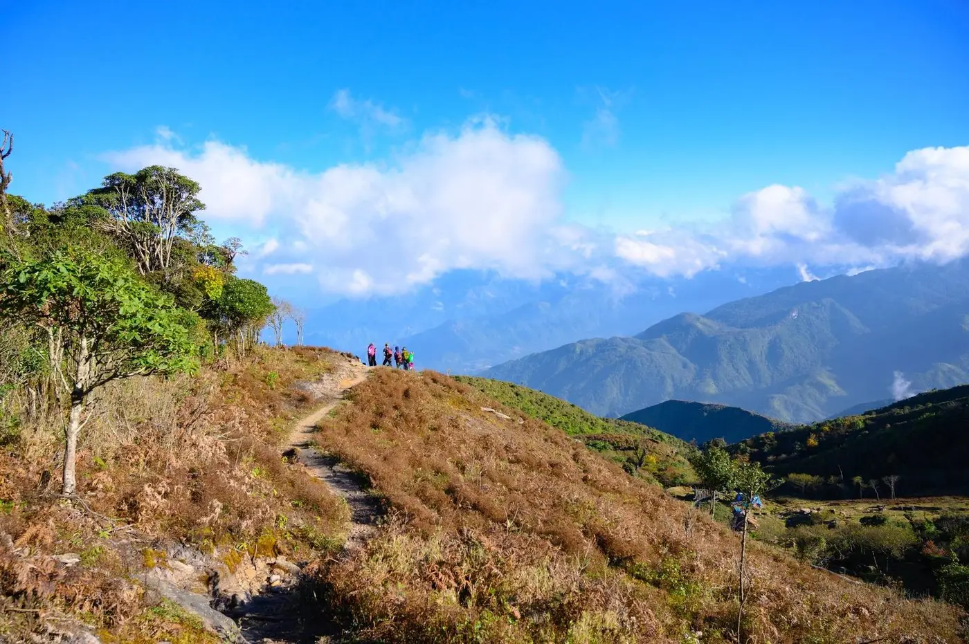 Trekkers walking a mountain trail near Lao Cai, northern Vietnam