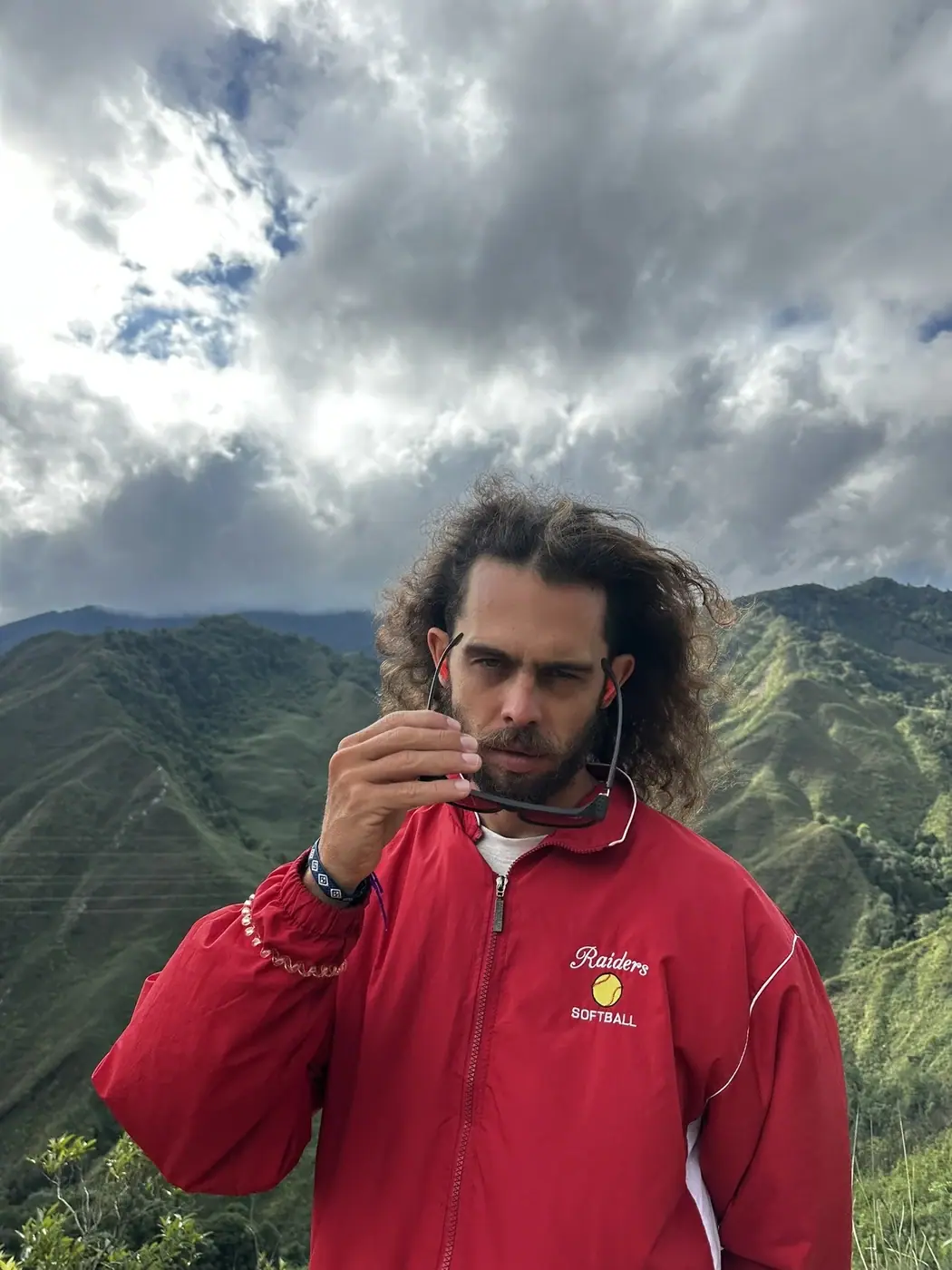Portrait in a red jacket against green Moc Chau mountains