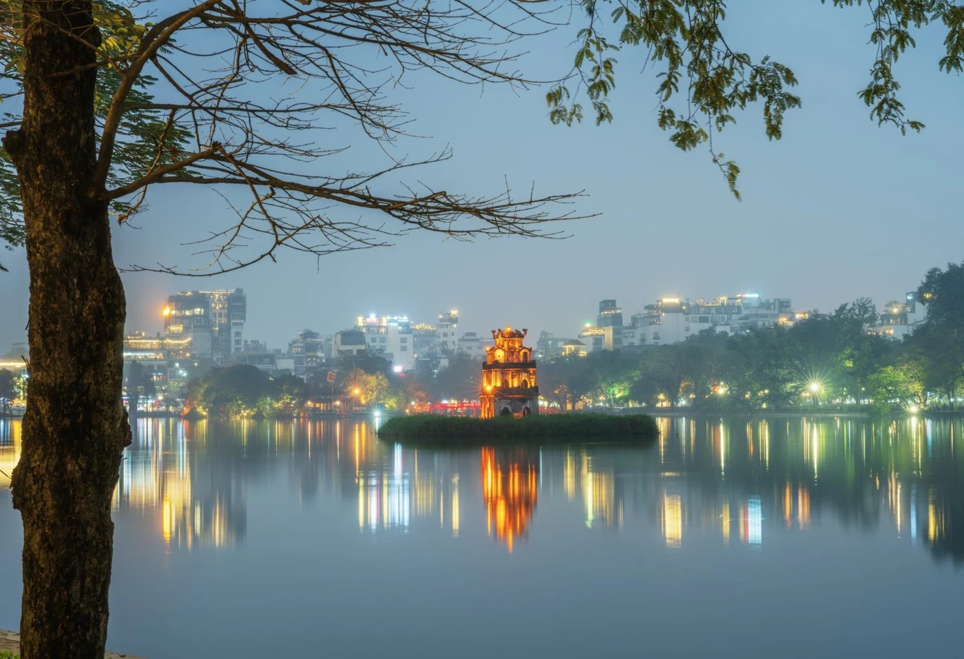 Turtle Tower lit up on Hoan Kiem Lake in Hanoi at night