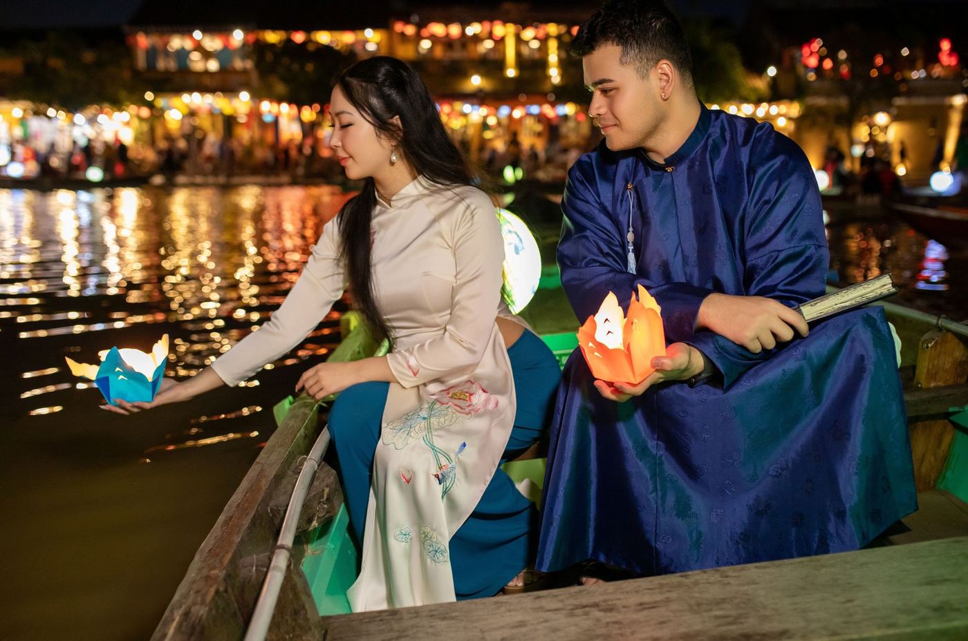 Paper floating lanterns drifting on the Thu Bon river in Hoi An at night