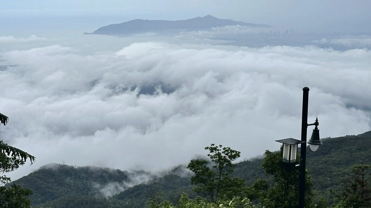 Staircase and flower garden at Ba Na Hills above a sea of clouds near Da Nang