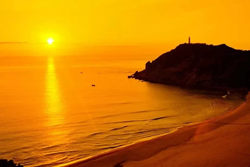 Fishing boats on the sea at sunset off Nha Trang