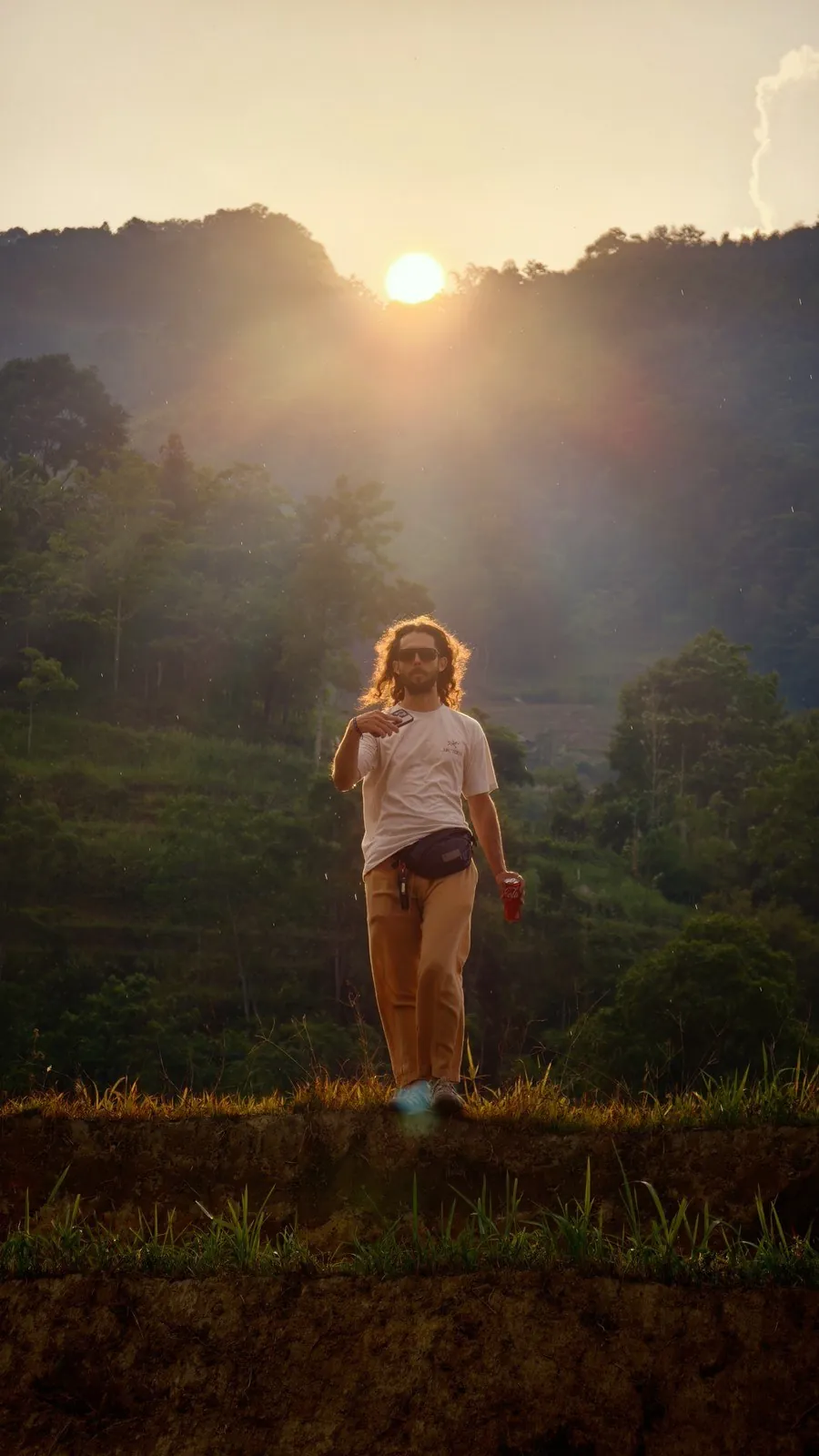 Sunset over green mountains and rice terraces