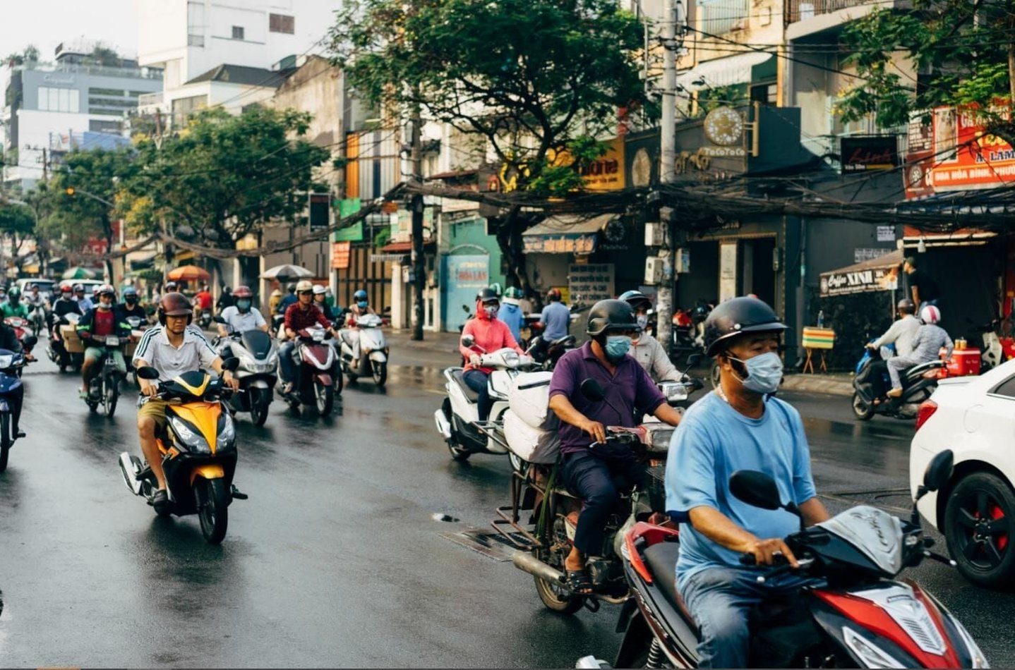 Motorbike traffic on a rainy Ho Chi Minh City street