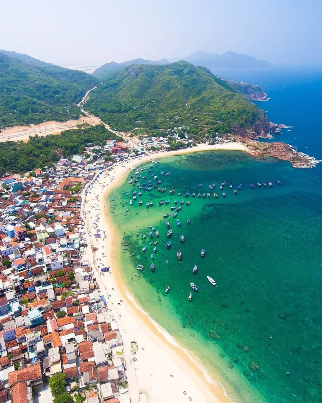Aerial view of a fishing bay with boats along the Vietnam coast