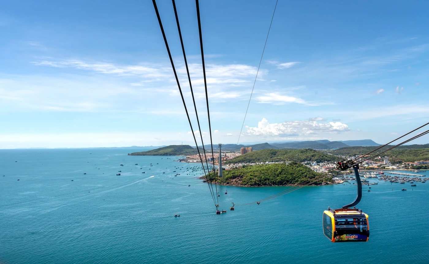 Cable car cabin suspended over turquoise sea near Phu Quoc island