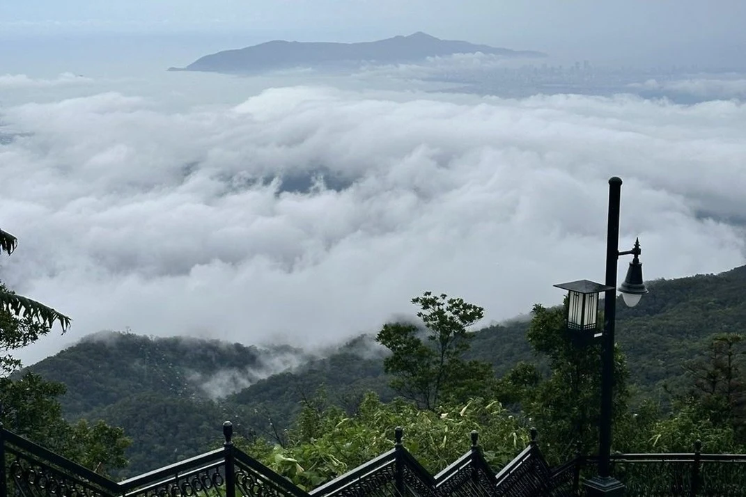 Low cloud over green hills near Da Nang seen from a Ba Na Hills viewpoint