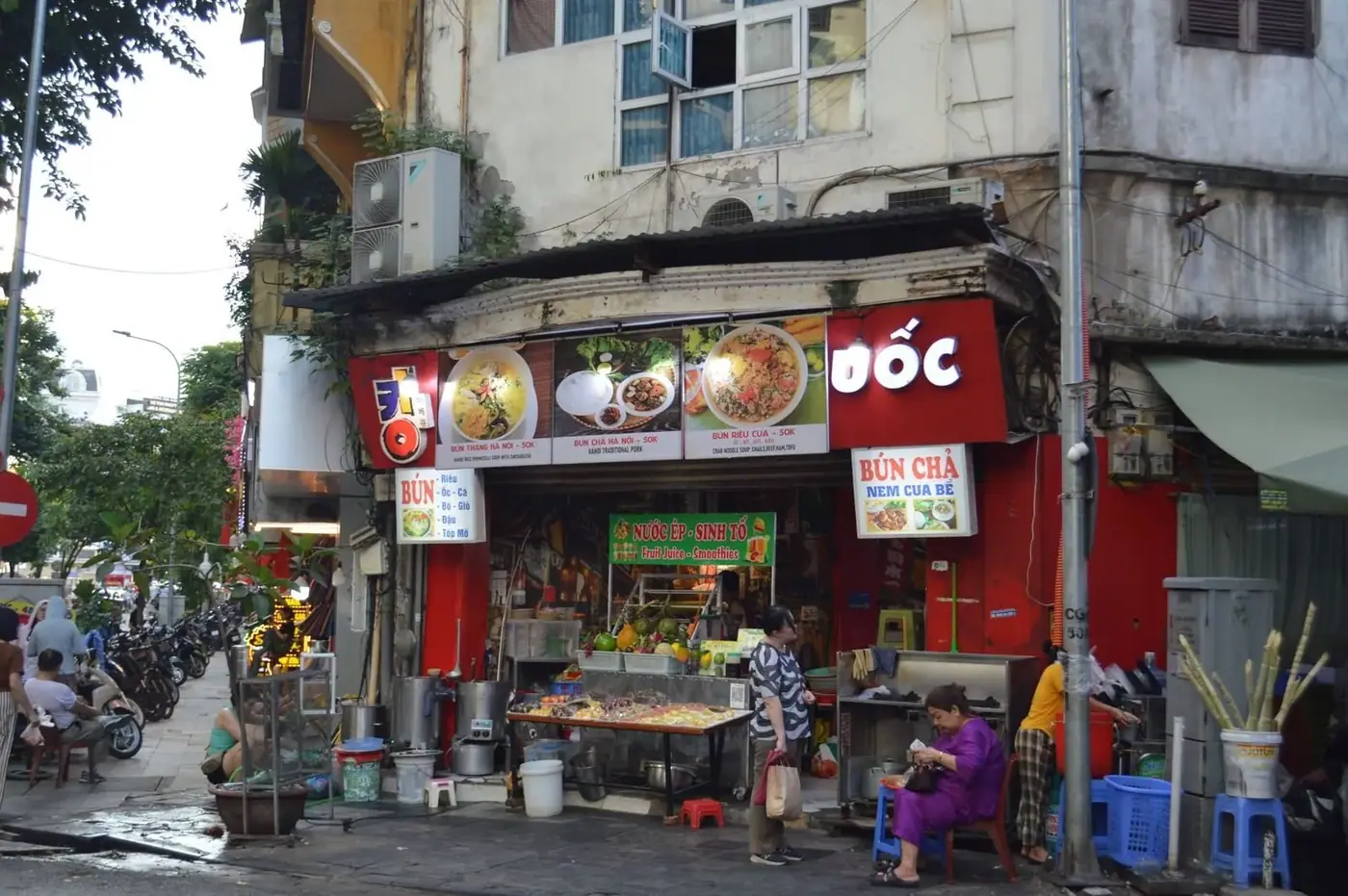 Vietnamese street food stall in Hanoi advertising bun cha and bun rieu