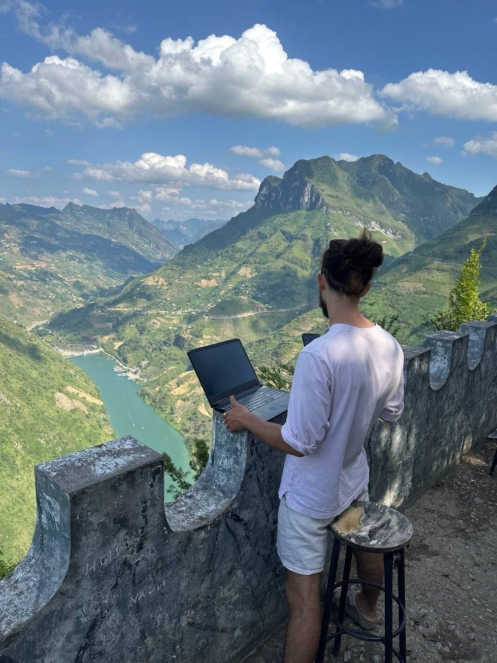 Working on a laptop above the Ha Giang canyon in Vietnam